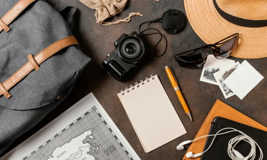 Backpack, map, and camera setup for travel content creators in influencer marketing campaigns.